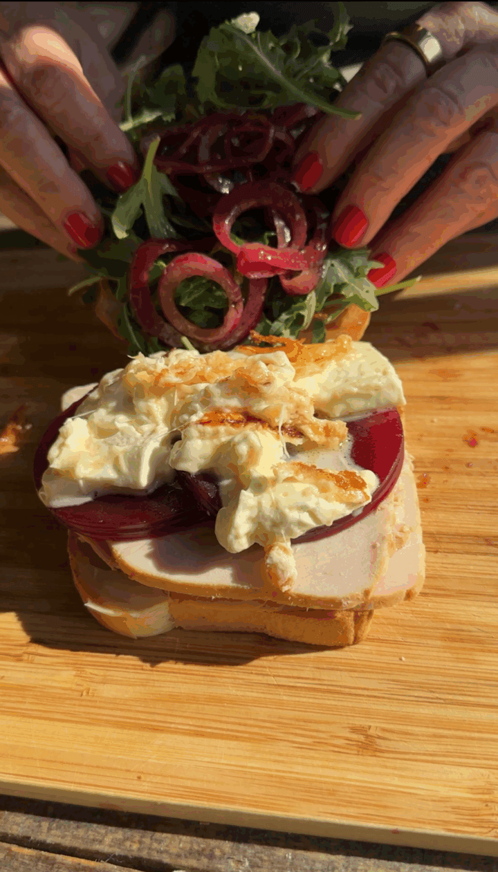 a photo of teri closing the leftover turkey sandwich