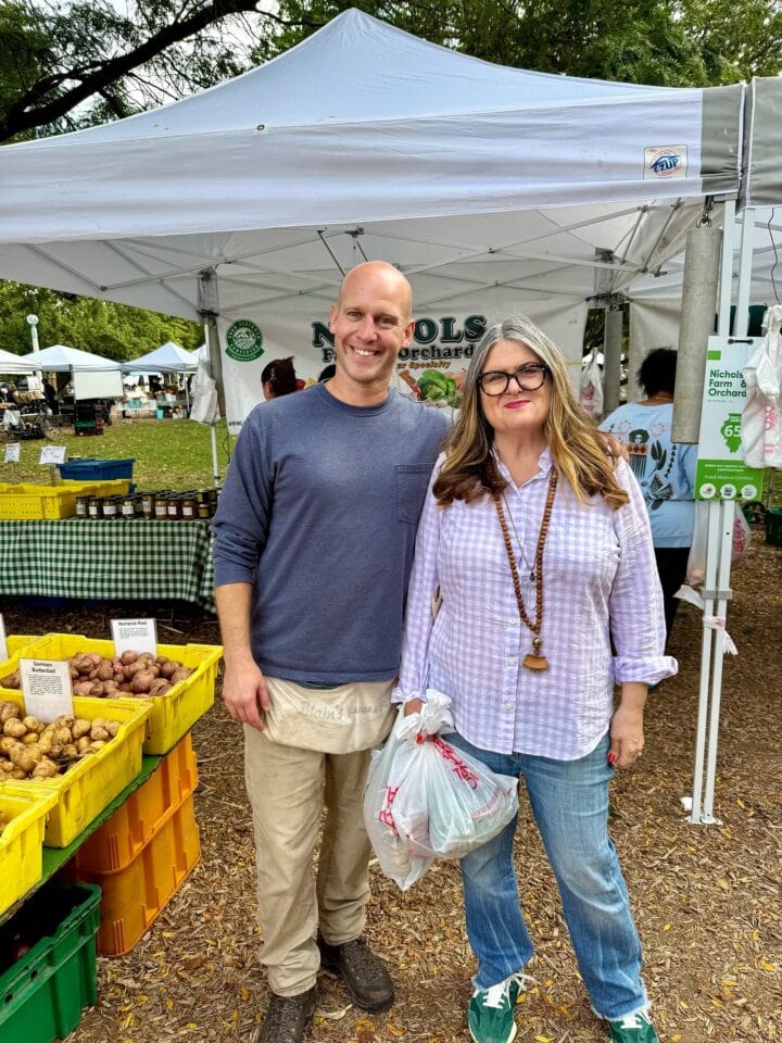 a photo of teri and farmer steve at the farmer's market