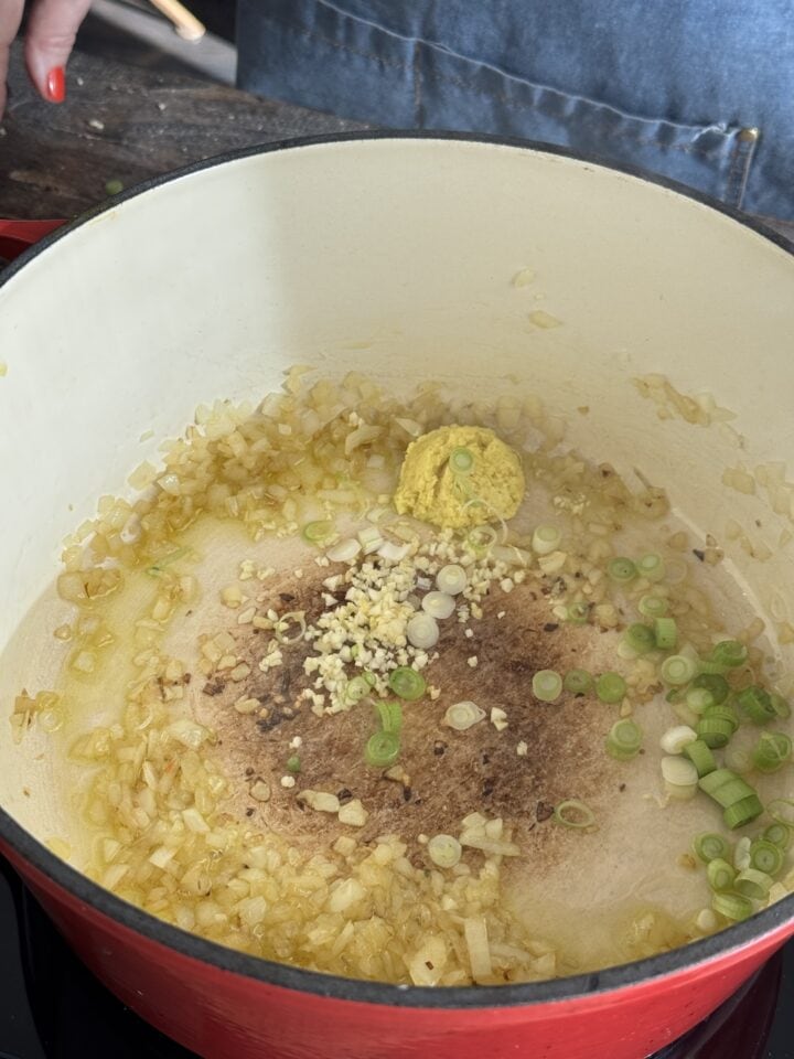 aromatics sauteing in a dutch oven with olive oil