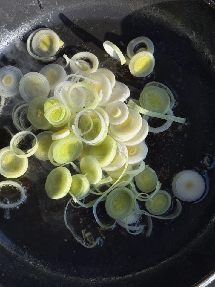 leeks in a cast iron pan