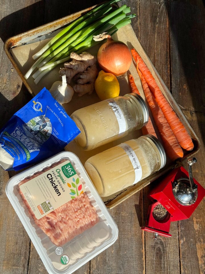 ingredients for chicken meatballs on a sheet tray
