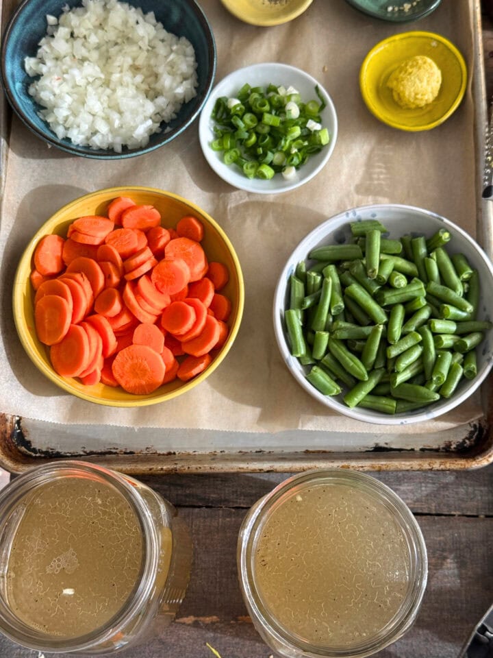 ingredients for chicken soup on a sheet tray