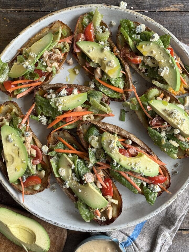 buffalo chicken potato skins on a white plate