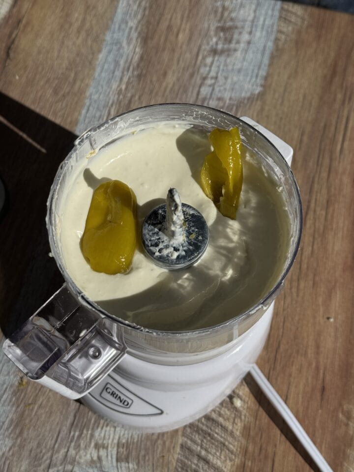 dirty martini dip in a food processor with pepperonicini in it