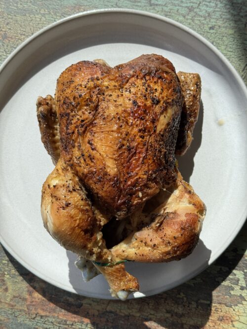 rotisserie chicken on a white plate
