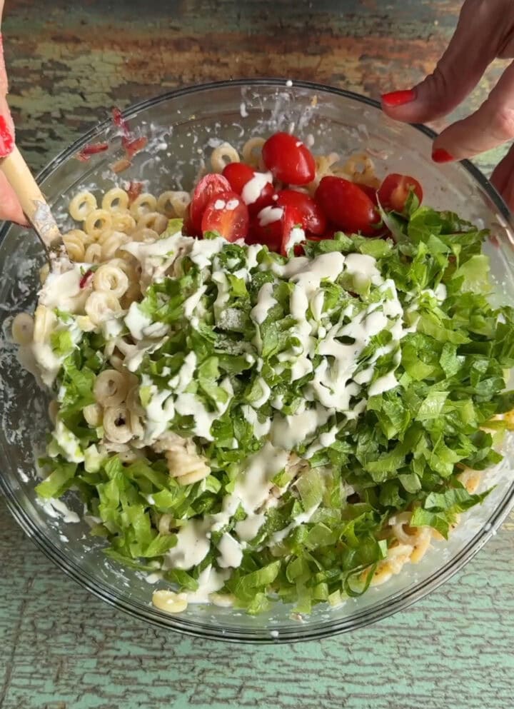 chicken caesar pasta salad in a glass bowl