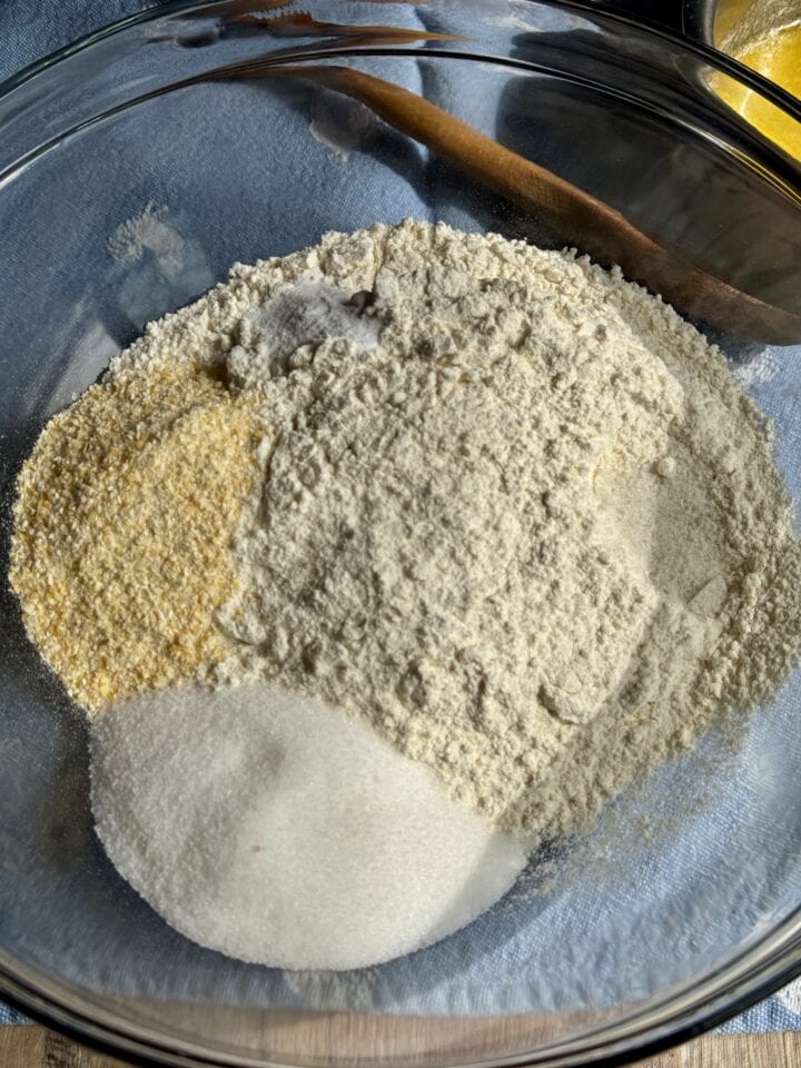the dry ingredients for blueberry waffles in a glass bowl