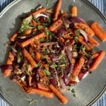 roasted carrot salad on a metal platter