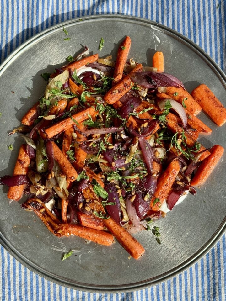 roasted carrot salad on a metal platter