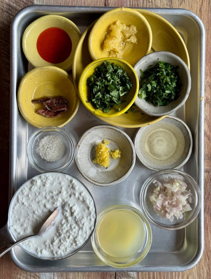 ingredients for high protein lettuce wrap dressing in small bowls on a sheet tray