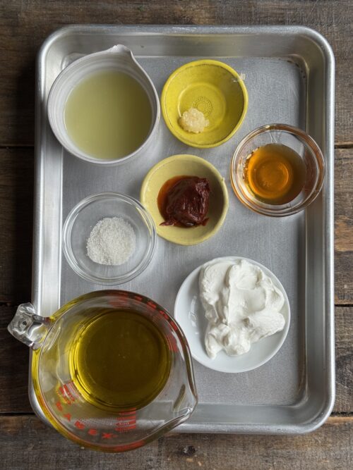 ingredients for chipotle lime dressing on a sheet pan