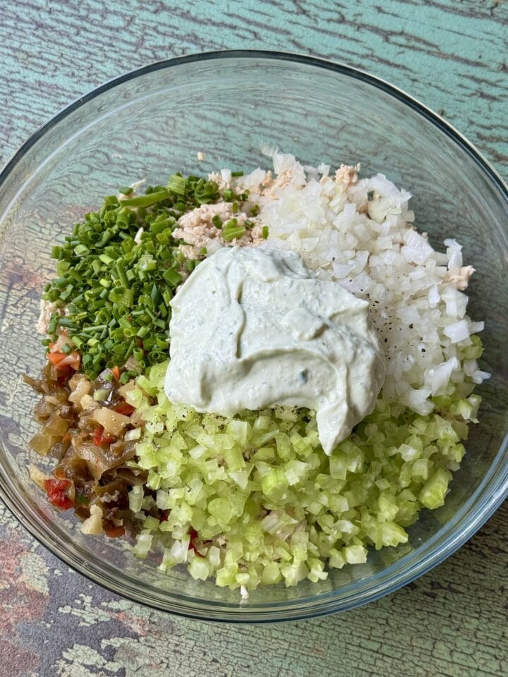 all ingredients for high protein chicken salad in a bowl