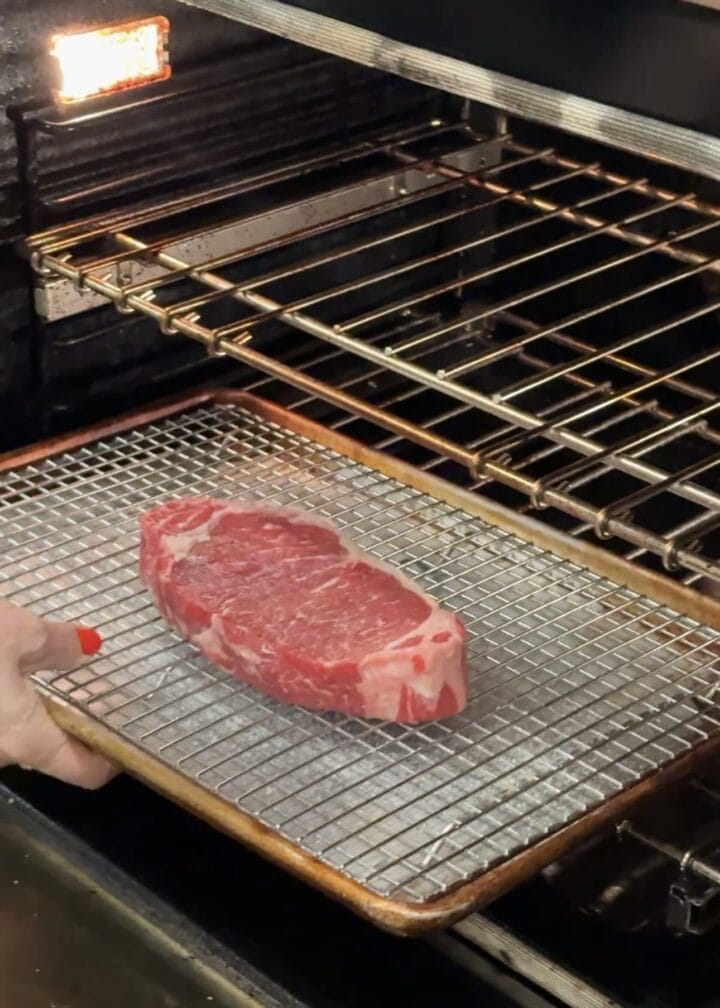 a steak going into the oven