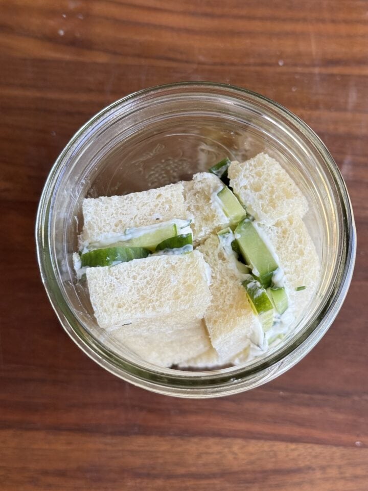 a cucumber sandwich in a glass jar