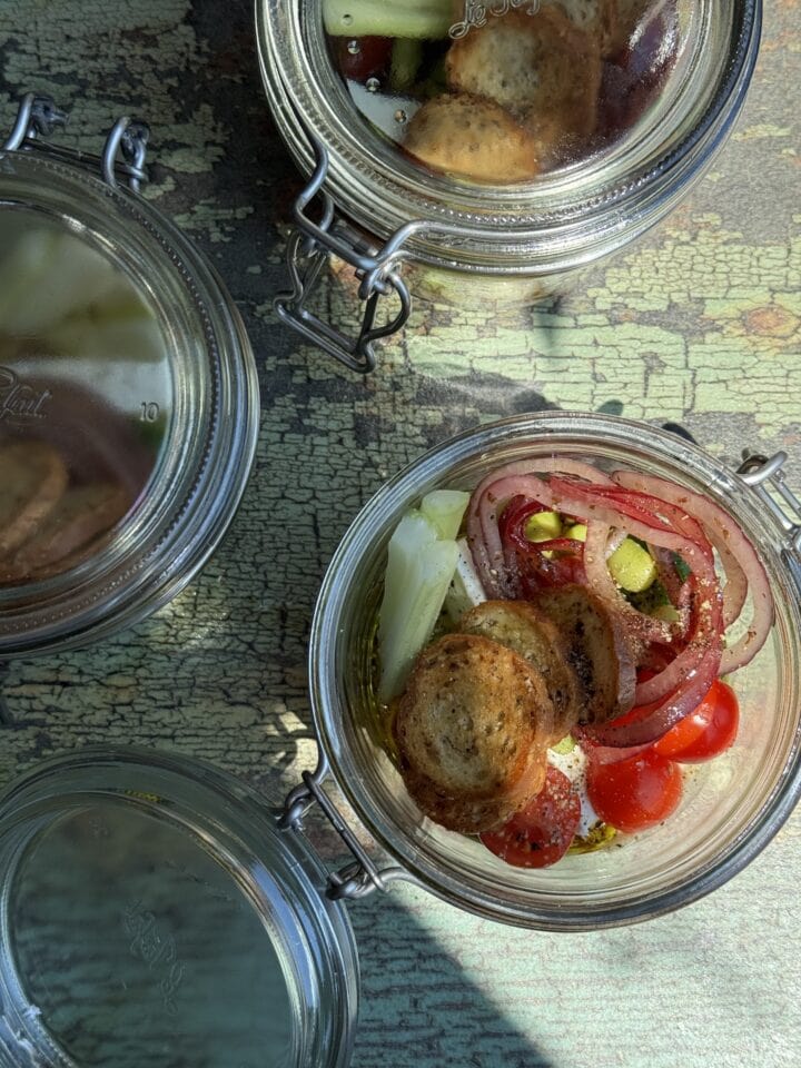 greek salad in three mini glass jars