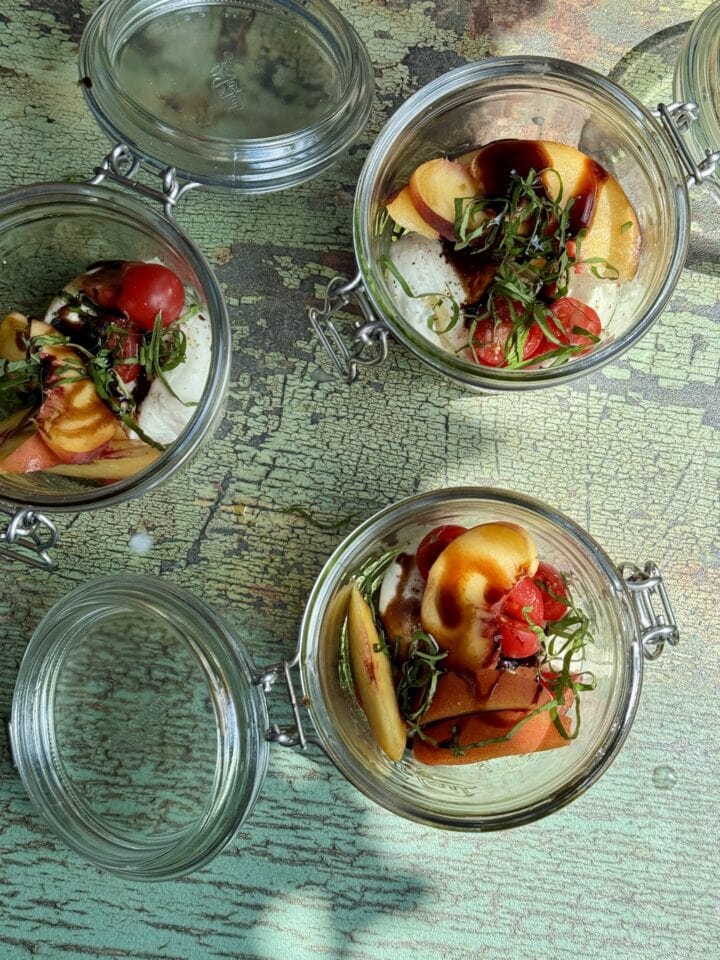 peach burrata caprese mini meal in three glass jars