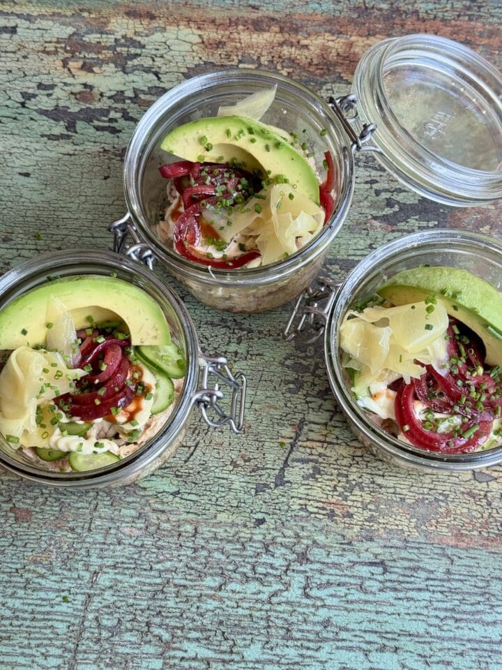 tunacado bowls in three separate glass jars