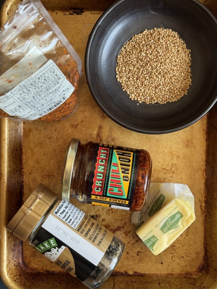 ingredients for chili crisp corn seasoning on a sheet pan