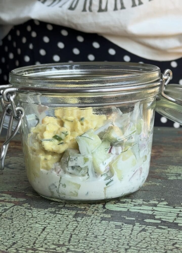 egg salad and cucumber salad in a glass jar