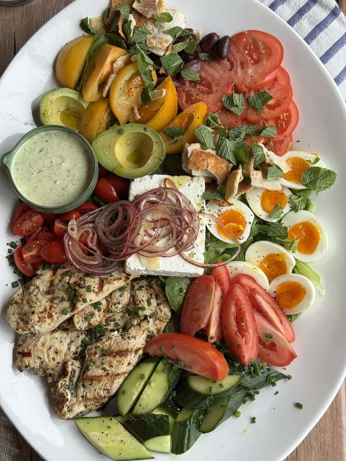 mediterranean chicken salad on a white platter