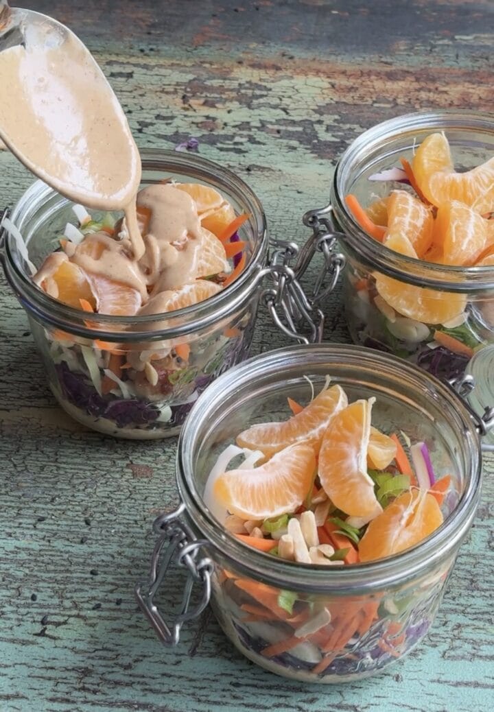 asian inspired chicken salad in three small jars
