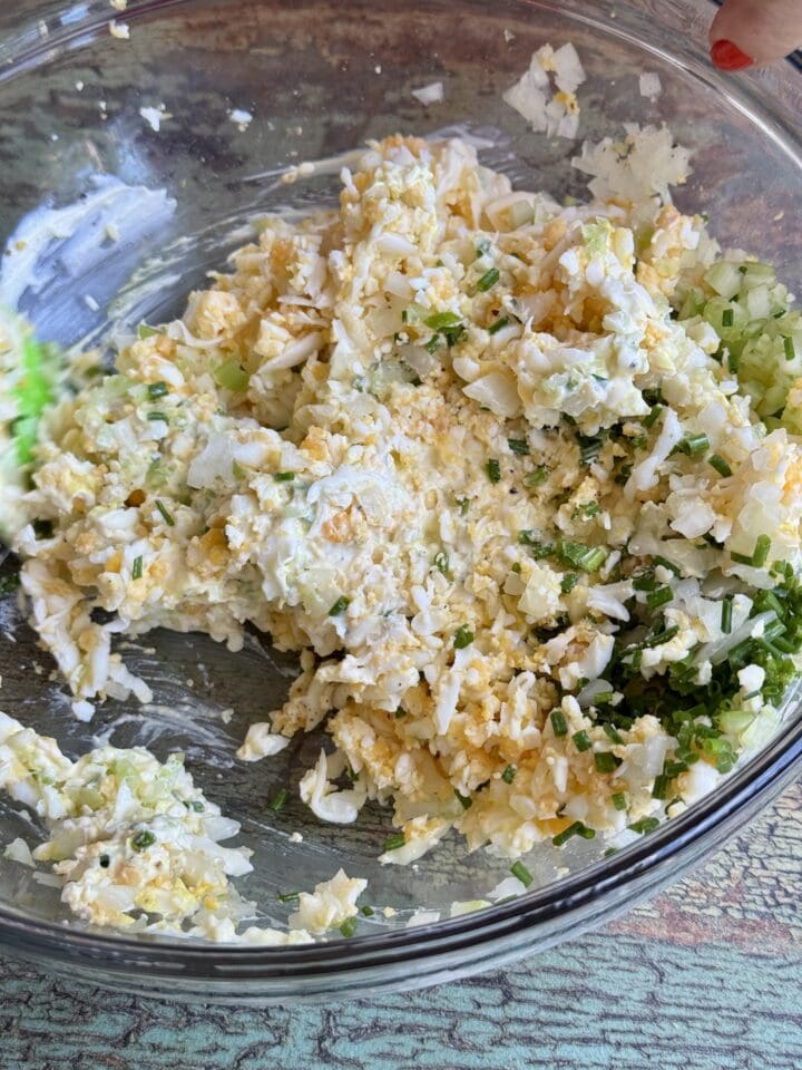 mixed egg salad in a glass bowl
