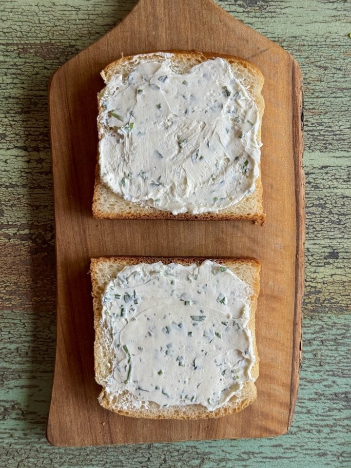 herbed cream cheese spread on two pieces of japanese milk bread