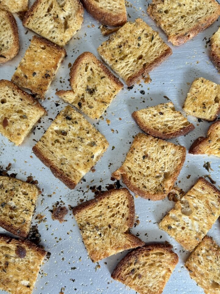 baked croutons on a baking sheet