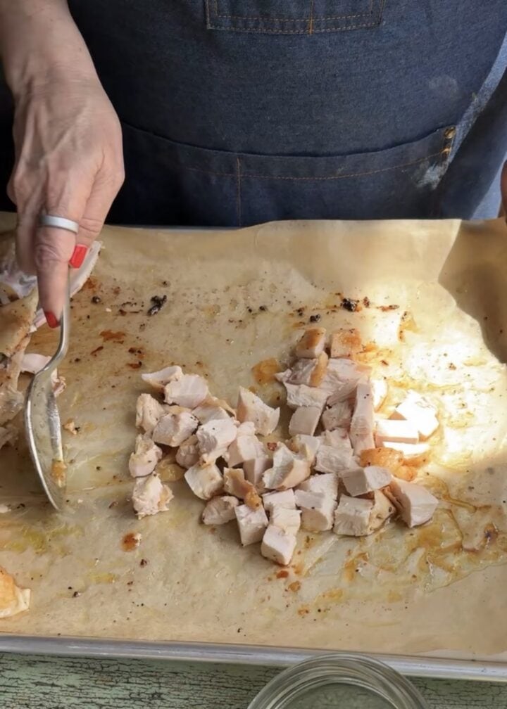 cubed chicken on a baking sheet