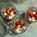 three jars with grinder salad in them