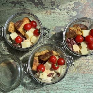three jars with grinder salad in them