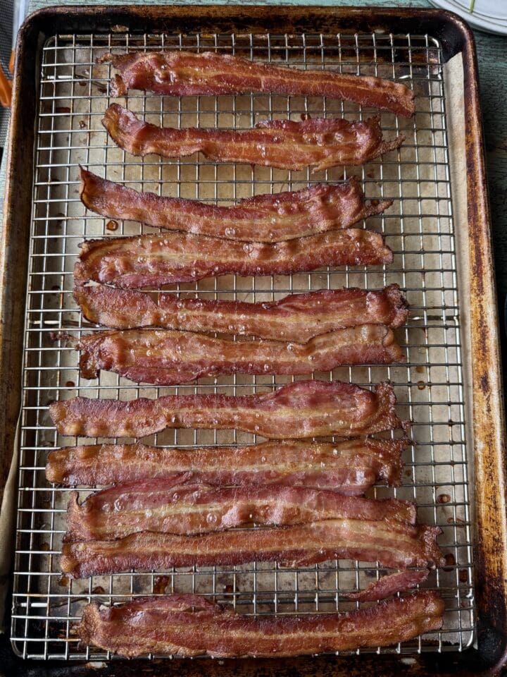 cooked bacon on a wire rack on a sheet pan