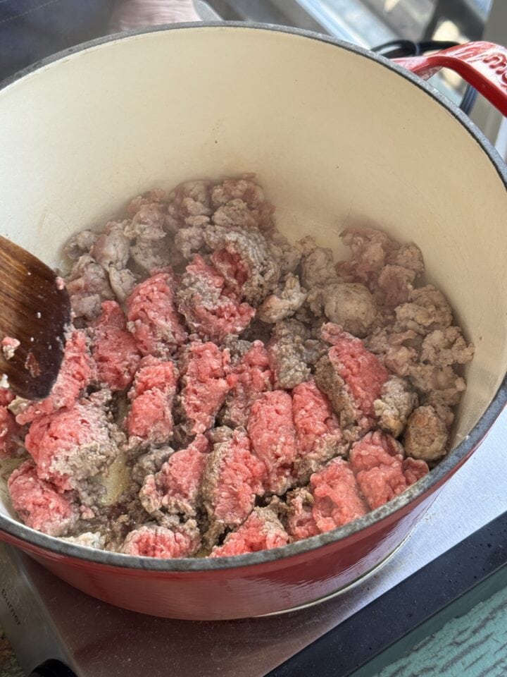 ground meat cooking in a dutch oven