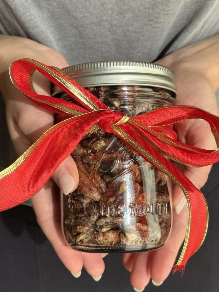 jar of candied pecans with red bow