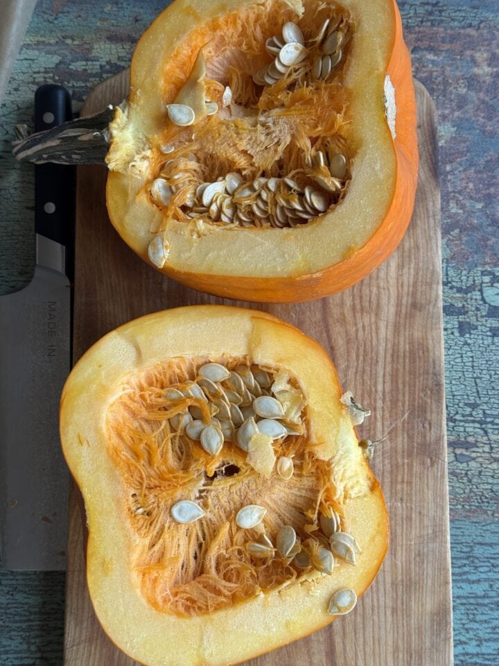 a raw pumpkin cut in half