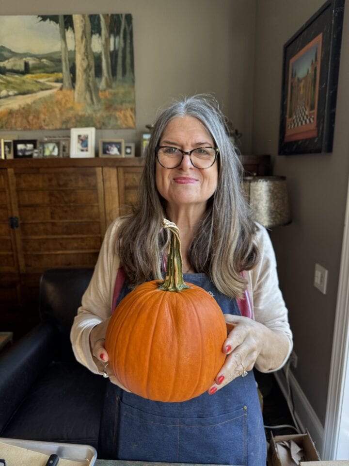 teri holding a pumpkin
